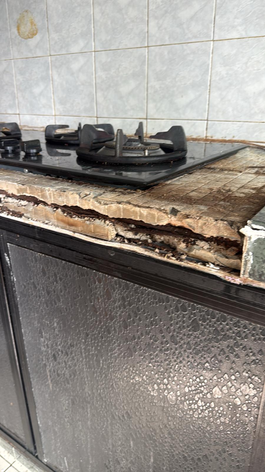 Before — damaged stove top